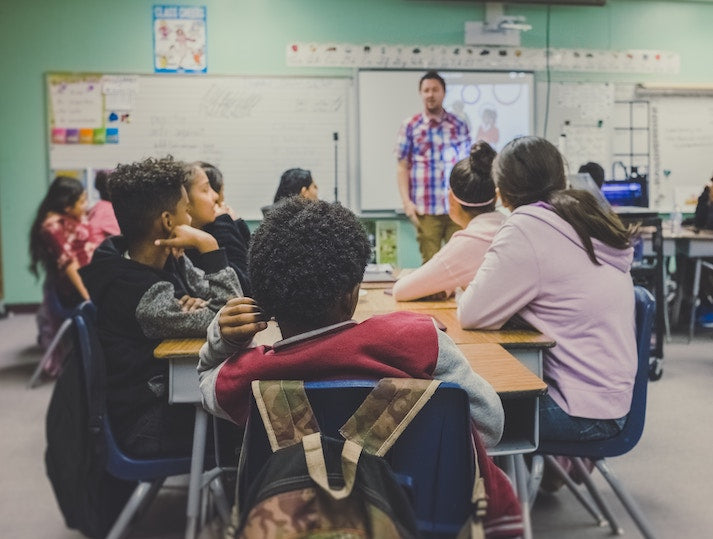men and woman sat in a classroom