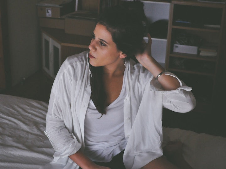 Woman getting out of bed