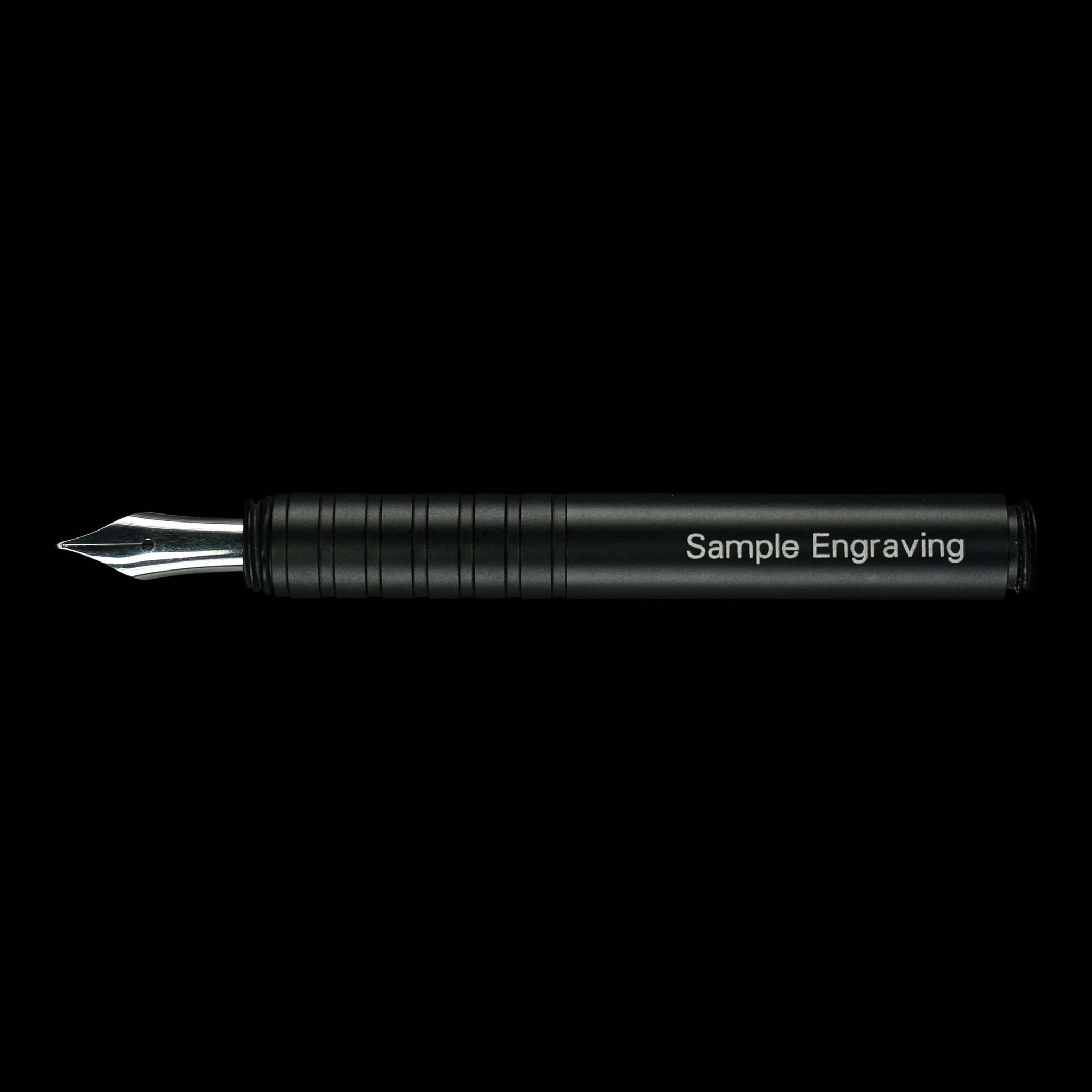 Sample engraving laser-burned into a black fountain pen, set in the Modern Fuel brand typeface