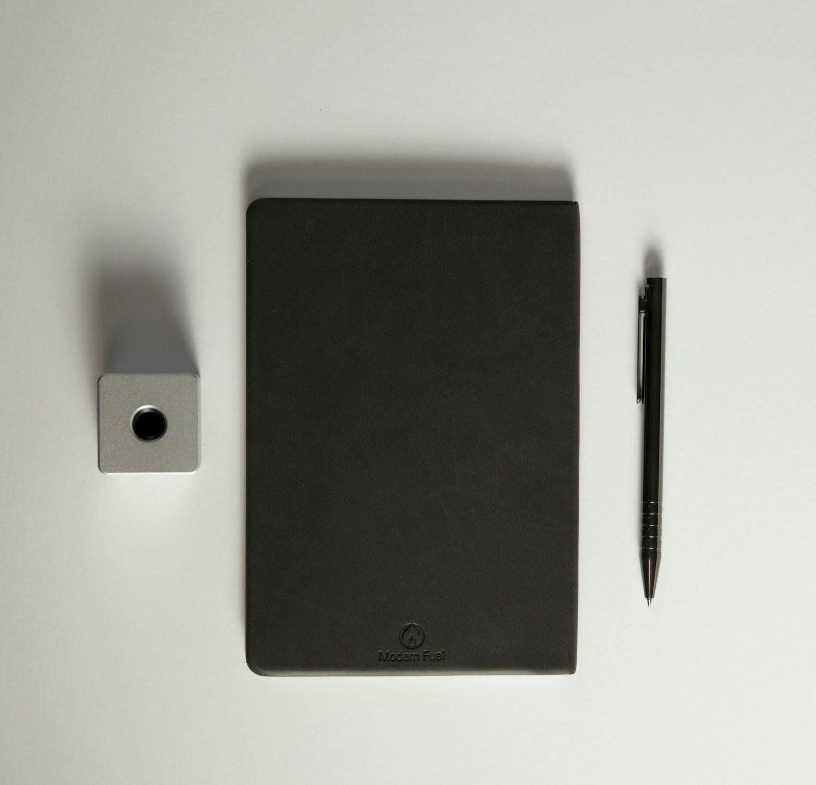 Pen with the free aluminum vertical stand and Modern Fuel notebook